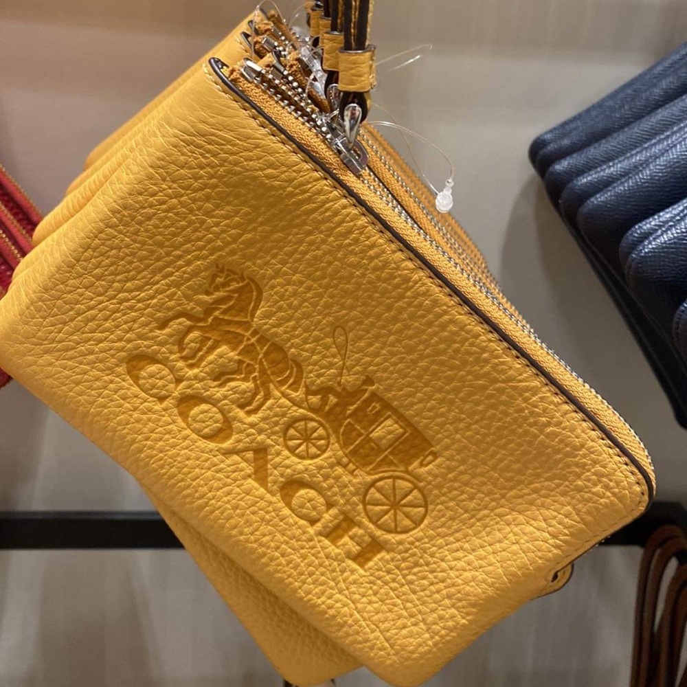 Corner Zip Wristlet In Signature Canvas